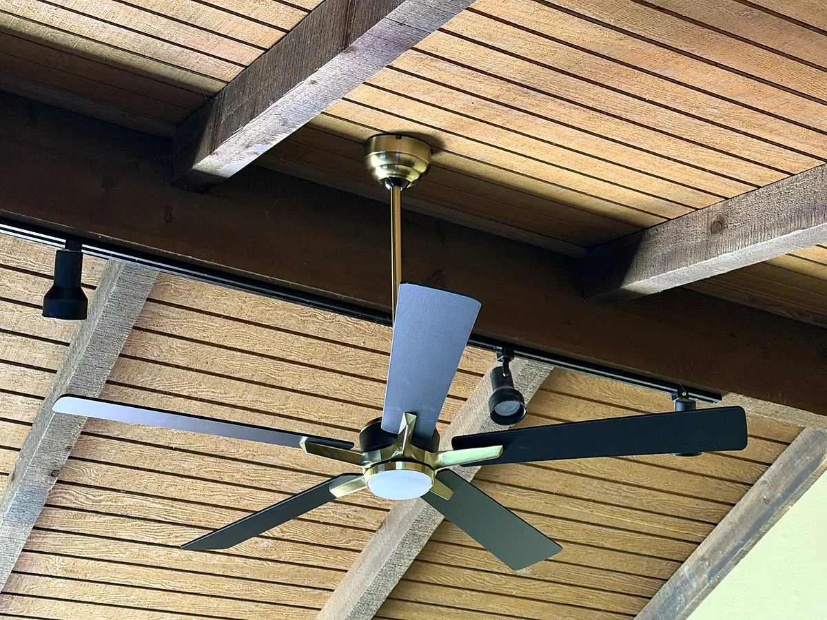 Ceiling fans installed beneath a covered patio