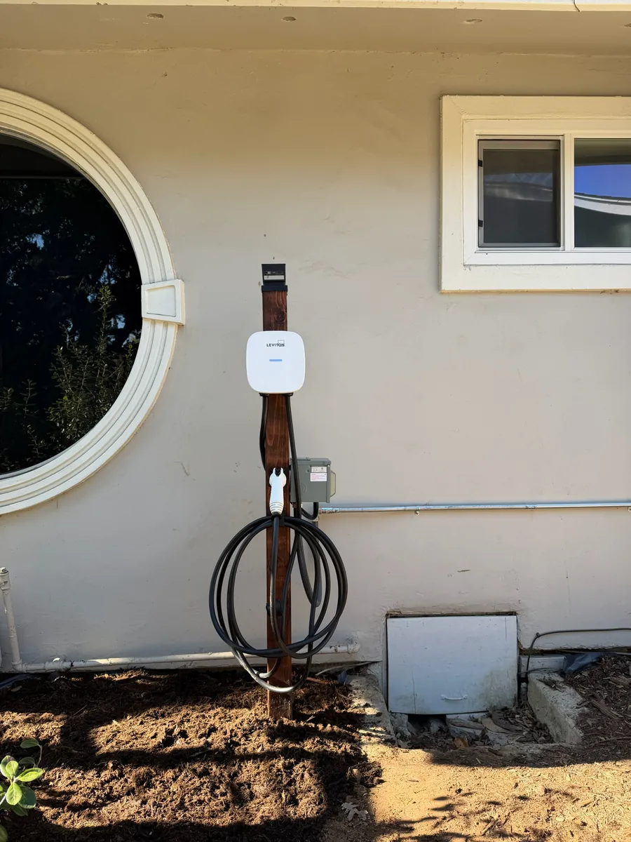 Level 2 EV charger installed in a residential garage