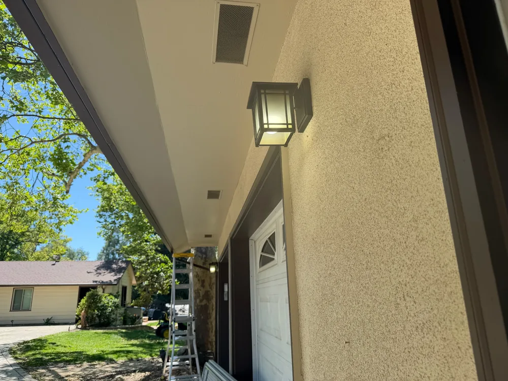 Outdoor wall-mounted sconce lighting installation