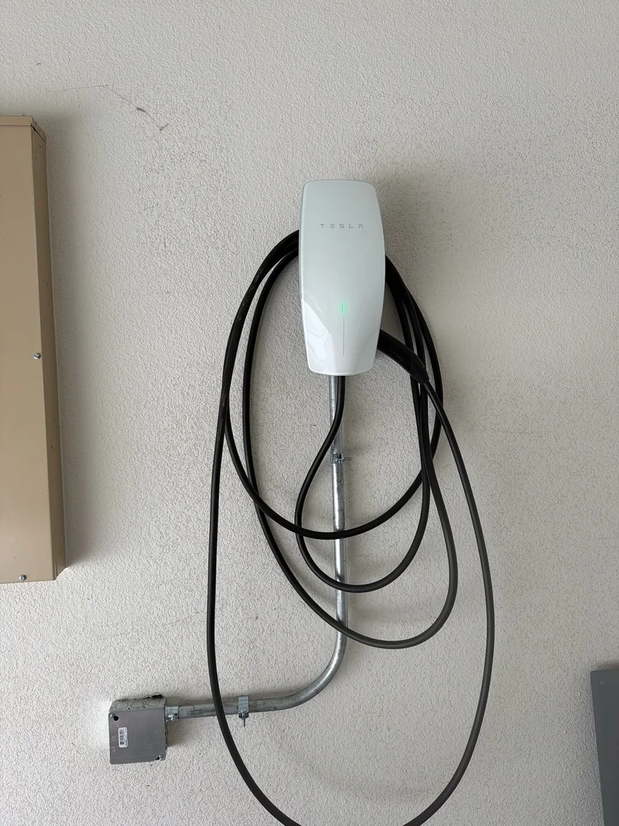 Tesla wall connector installed in a residential garage